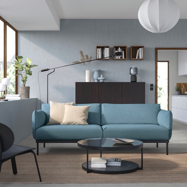 A Gunnared light blue ÄPPLARYD 3-seat sofa in the living room