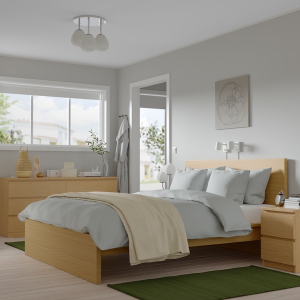An oak veneer/oak effect STORKLINTA bedroom furniture
