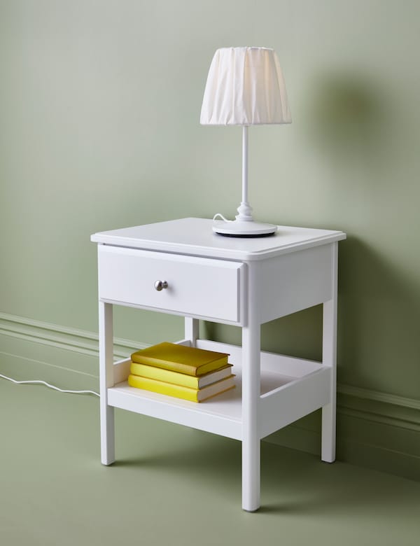 A white TYSSEDAL bedside table in the bedroom