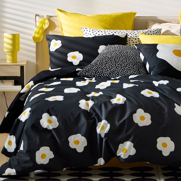 A dimmable/yellow SPETSBOJ table lamp in the bedroom