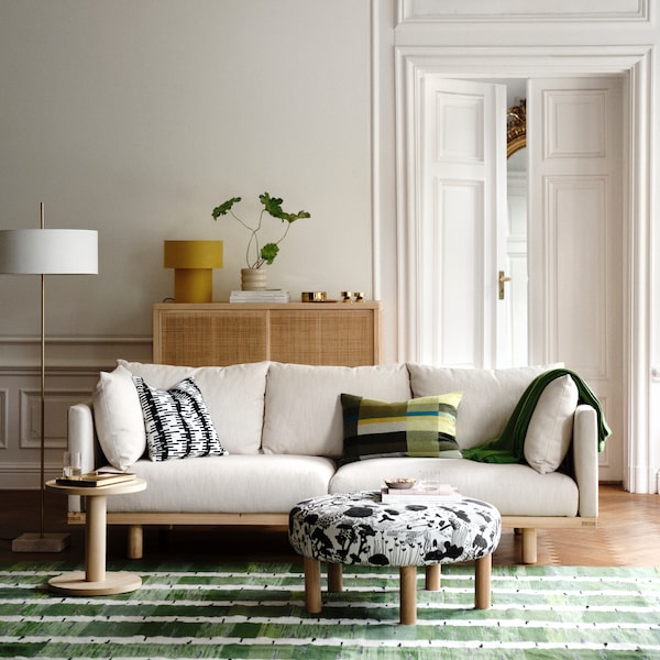 An in/outdoor/beige HASSELBUKETT plant pot in the living room